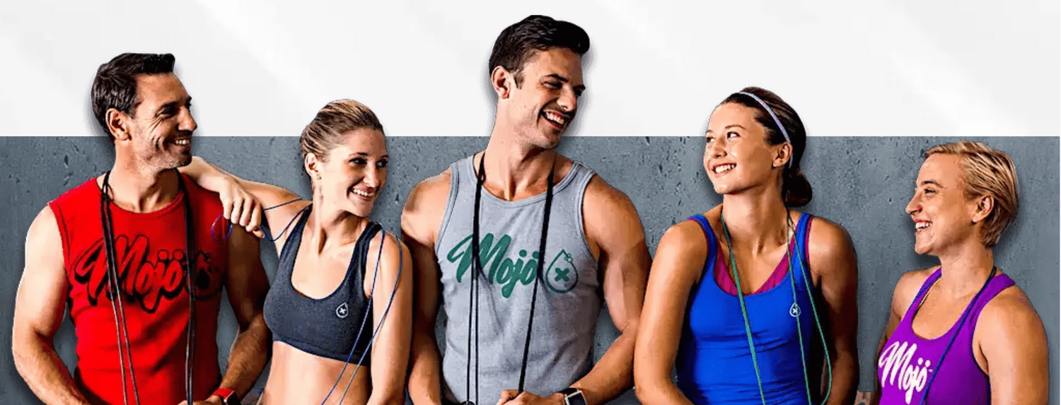 The Mojo crew — five friends in Mojo tank tops laughing together