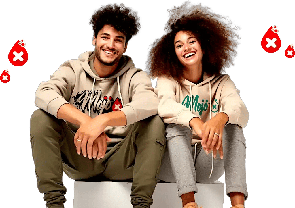 Smiling couple sitting in Mojo hoodies